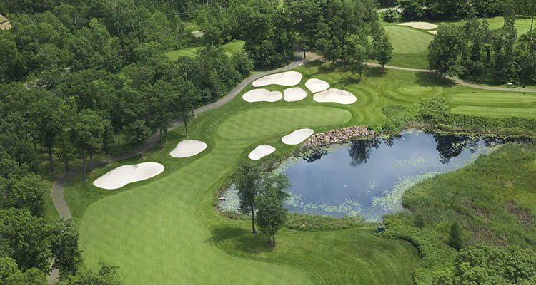 Some golf courses possess ponds, lakes or streams as water hazards.