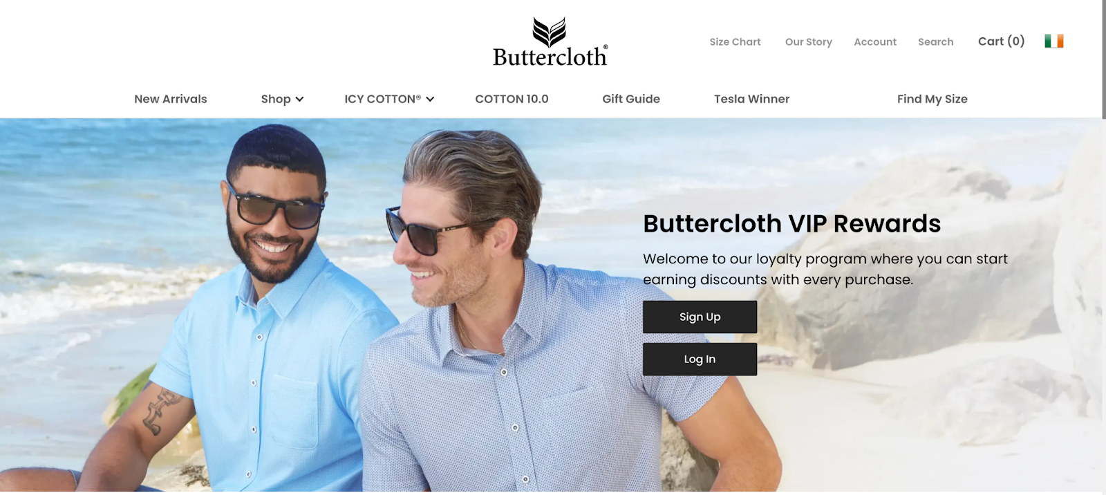 Ecommerce loyalty explainer page–A screenshot from Buttercloth’s rewards explainer page showing two men sitting on a beach with text reading “Buttercloth VIP Rewards” and Sign Up and Log In buttons.