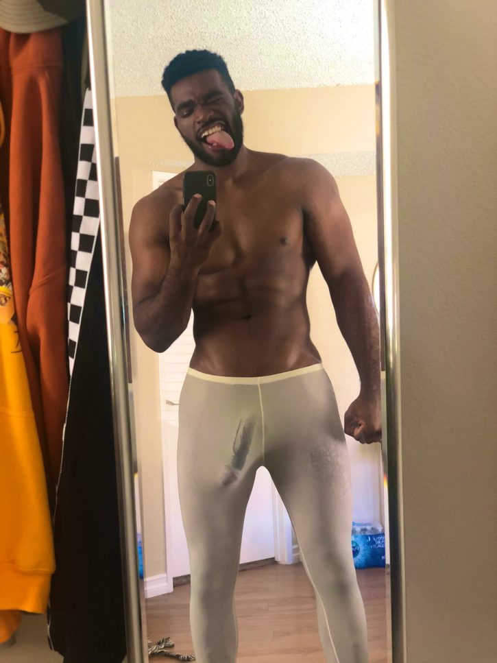 Marshall Price posing for a mirror selfie on his iPhone x in see through white lounge pants