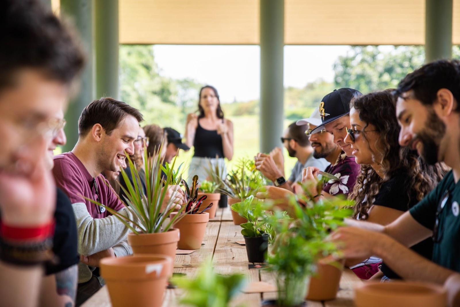 CEO Holly K. Pilcavage addresses the Coal Creative team at Kirby Park. The team planted houseplants from Edward’s Garden Center.