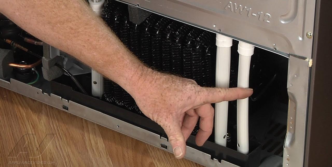 Repairing water leak inside fridge: Freezing drain vs. clogged drain line 