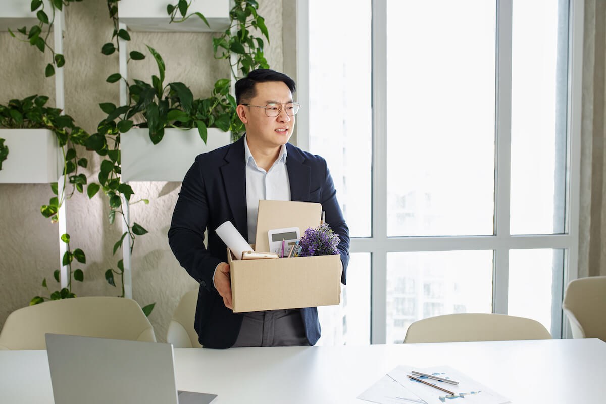 Extended leave of absence: employee carrying a box of his things