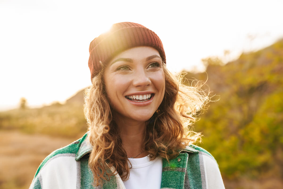 Close up shot of a woman wearing a bonnet and smiling