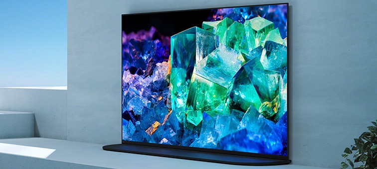 BRAVIA TV in living room on stand in Back position style for room harmony with image of colourful glass and crystals on screen