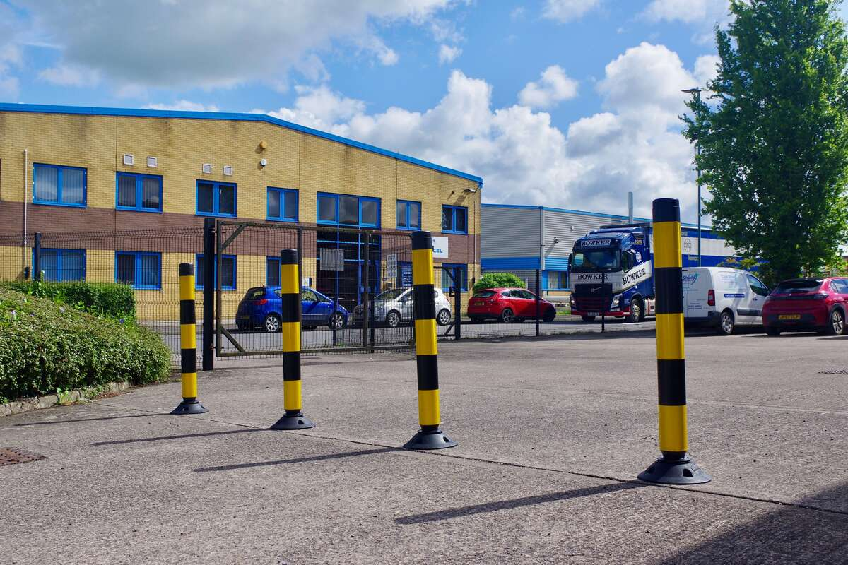 Traffic Cone Guide; Flexible Posts in Hi-Viz Yellow and Black in a commercial car park.  