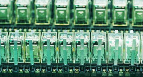 Relay actuators inside an industrial power case with flyback protection