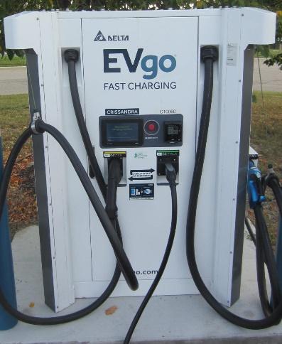 A picture containing text, gas pump, outdoor, bicycle  Description automatically generated