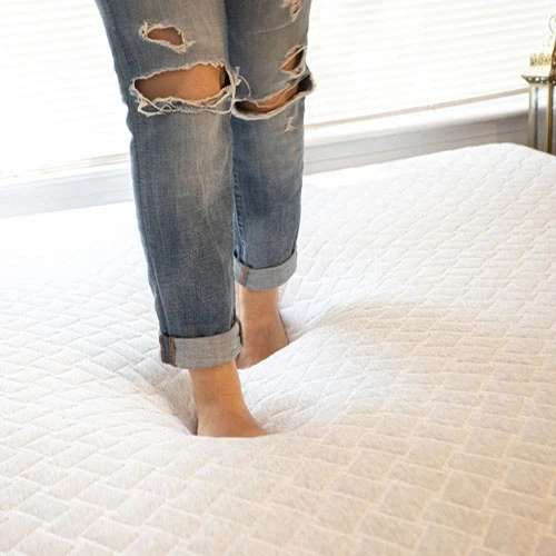 To make a tempurpedic pillow or mattress softer apply pressure by walking on it or squeezing it