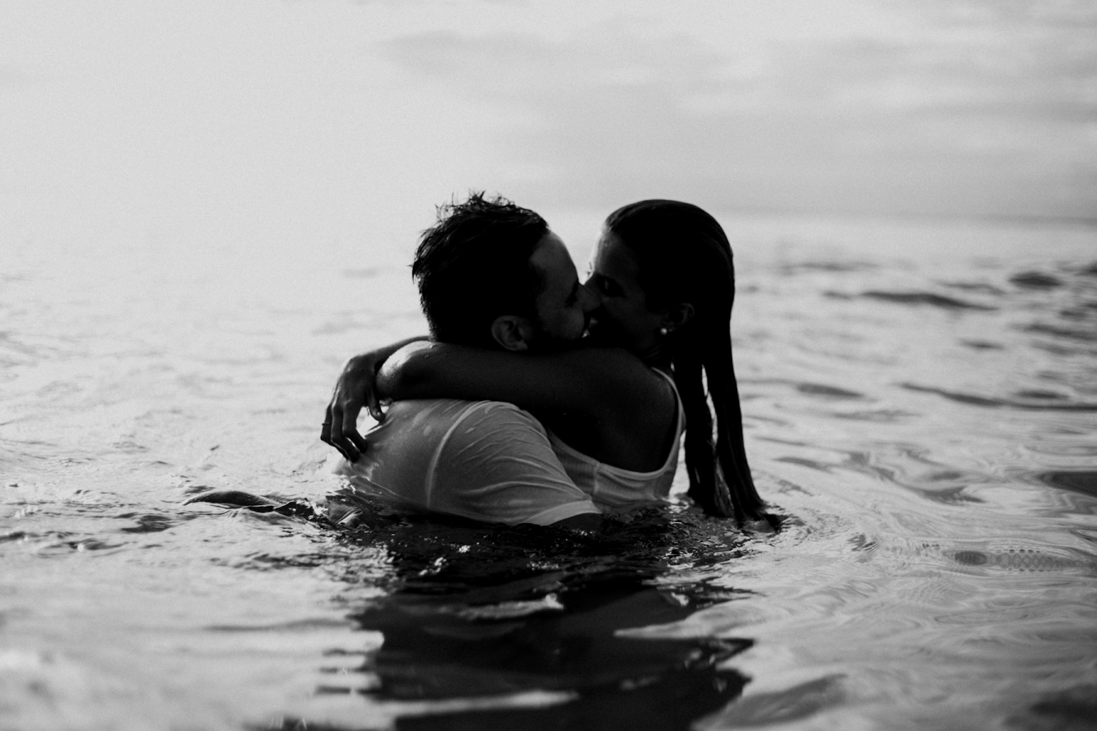 couple making out in the ocean