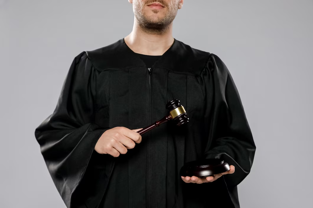 Male judge with a gavel.