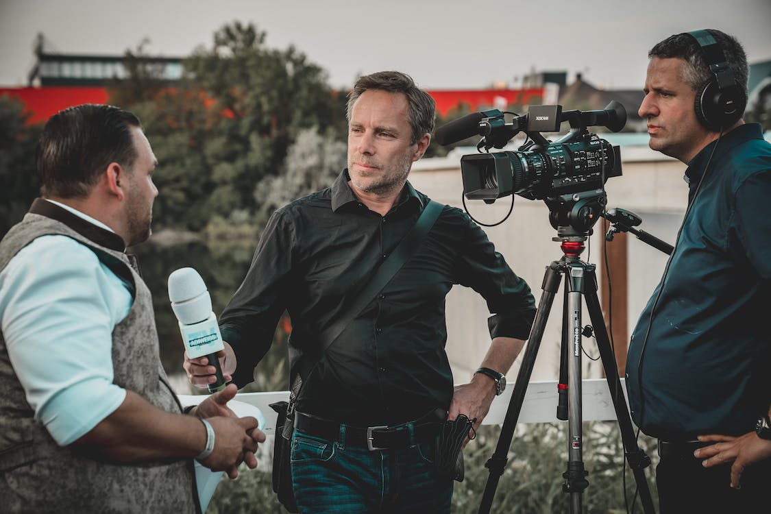 A journalist with his camera crew