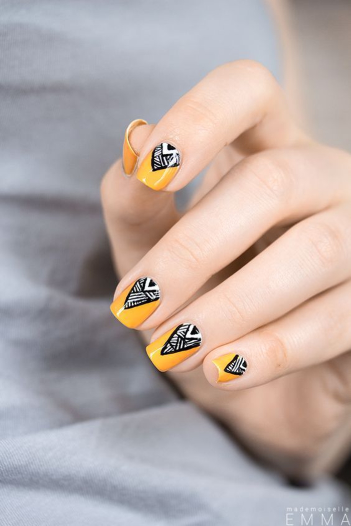 gelber Nagellack, schwarze Dekoration, Sommerideen für schöne Fingernägel