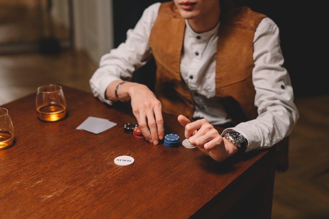 Free Person Holding Poker Chips Stock Photo