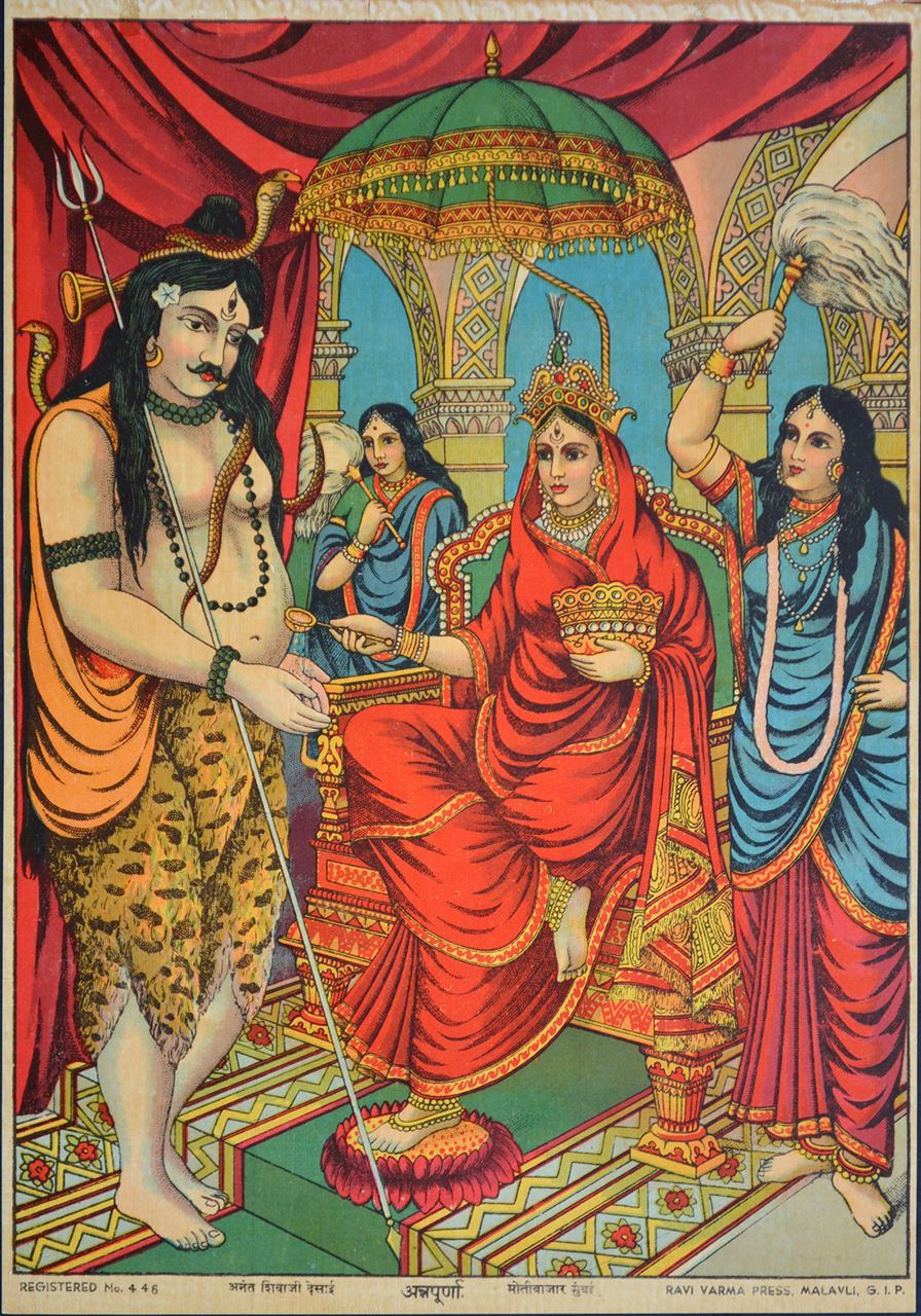 In this image, Goddess Annapurna is seen sitting on a throne and giving alms to Shiva. There are two women behind her waving fans in the air.   