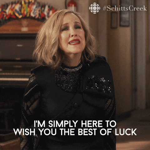 Moira Rose from hit show Schitt's Creek dress glamorously stating 'I'm simply here to wish you the best of luck'.