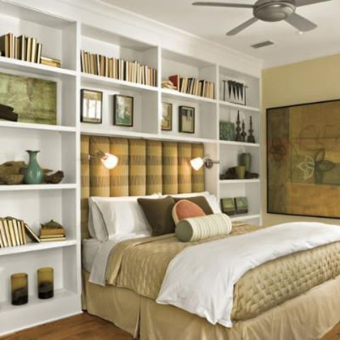 To add more storage space and create a visually pleasing effect, add a built-in bookcase up against the wall behind the bed. 