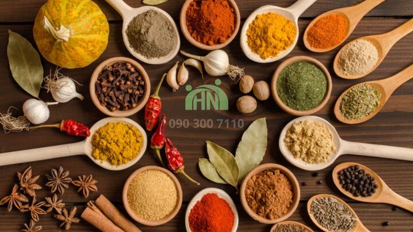 A group of different spices in wooden bowls Description automatically generated