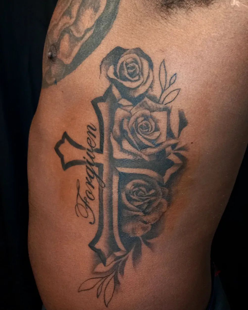 Rose And Cross Tattoo On Rib