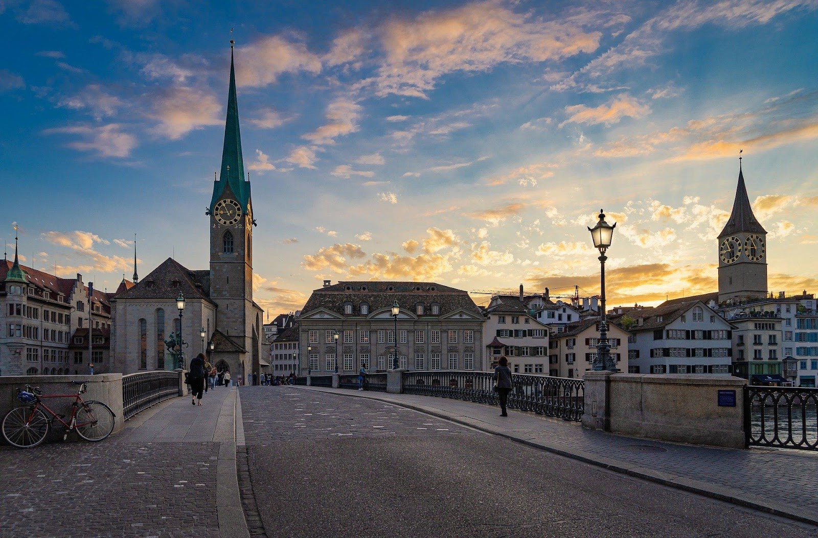 zurich old town bridge medieval church clock tower during sunset switzerland