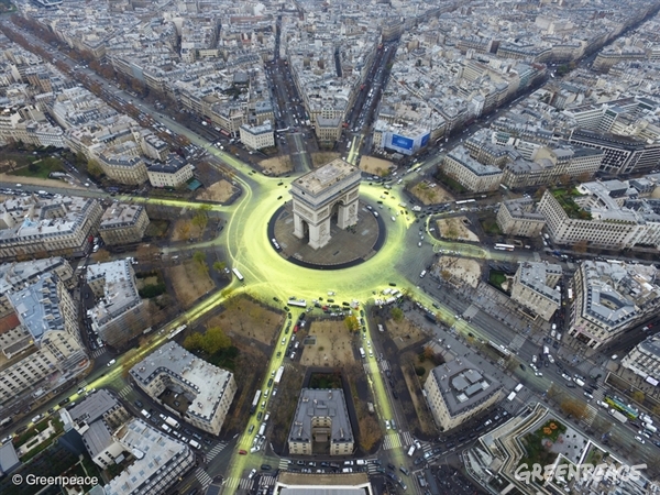 Arc de Triomphe Sun Action in Paris during COP21 As the Paris climate conference enters the closing stretch, Greenpeace activists create a solar symbol around the world-famous Paris landmark, the Arc de Triomphe, by painting the roads yellow to reveal the image of a huge shining sun. The eco-paint is non-polluting water-based and will last for the rest of the conference. It will be visible from the air when politicians fly out of Paris this weekend, reminding them that whatever they agree here, the only credible way to beat climate change is to replace fossil fuels with the high-technology renewables systems being rolled out across the world.