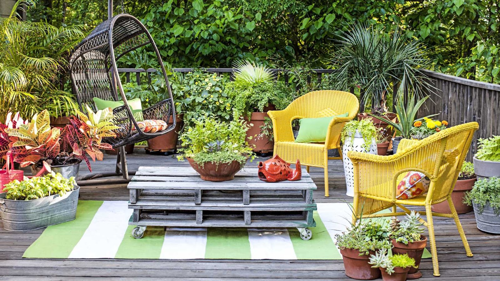 Live outdoor space filled with colorful and interesting furniture and small decor