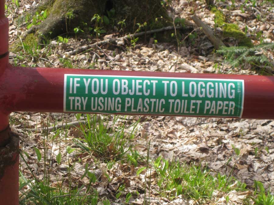 Bumper sticker reads "If you object to logging try using plastic toilet paper"