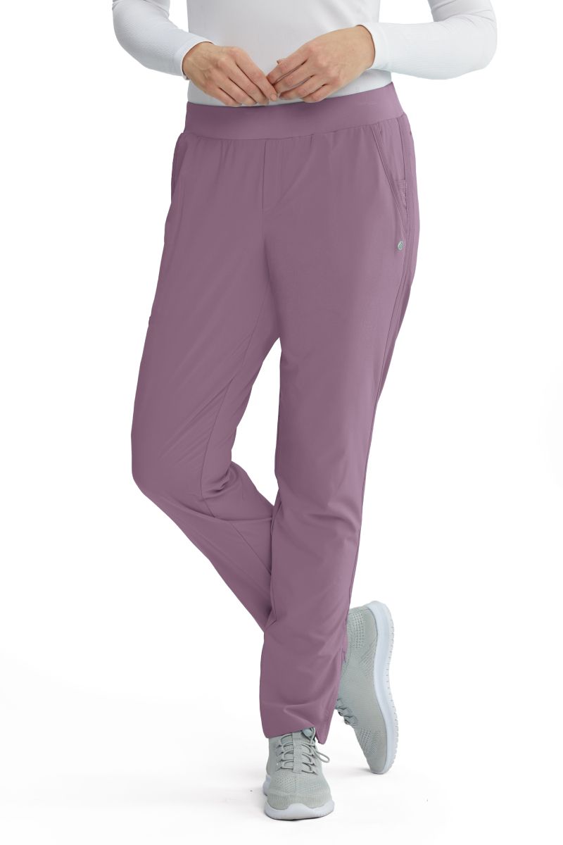 Model wearing Barco One Wellness Radiance Pant in the colour Dusk Purple.