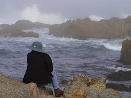 022916 Woman watching waves in fog.jpg