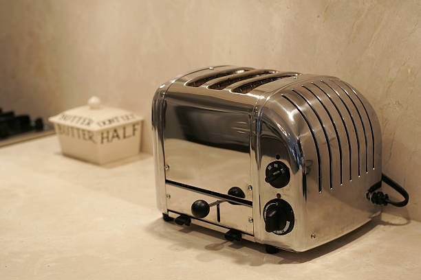Kitchen Detail Kitchen Kounter with toaster and butter jar. toaster stock pictures, royalty-free photos & images