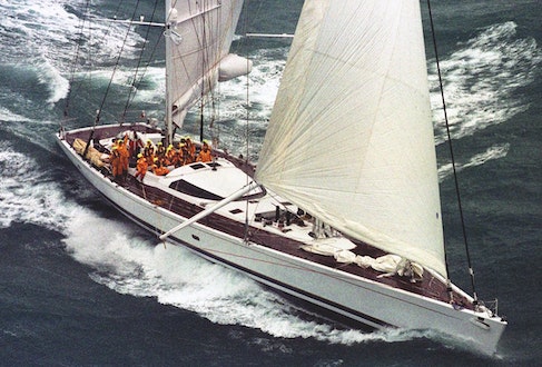 His record-breaking yacht, Mari Cha III crosses the line at Lizard’s Point in 1998