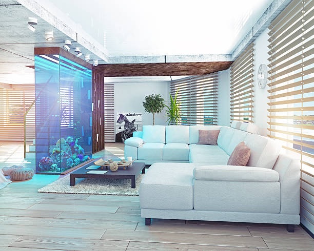 Living room with L-shaped sofa and aquarium with plants