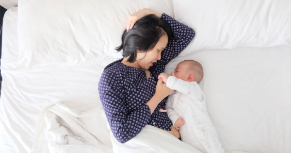 best lactation supplements for nursing moms - photo of mom and baby on a bed