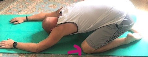Yoga Pose Modification: Try Adding a Yoga Block Under Your Bottom During Child's Pose