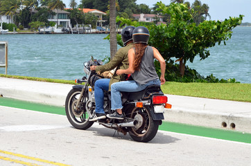 Florida Motorcycle Crash Data two people riding a motorcycle in florida