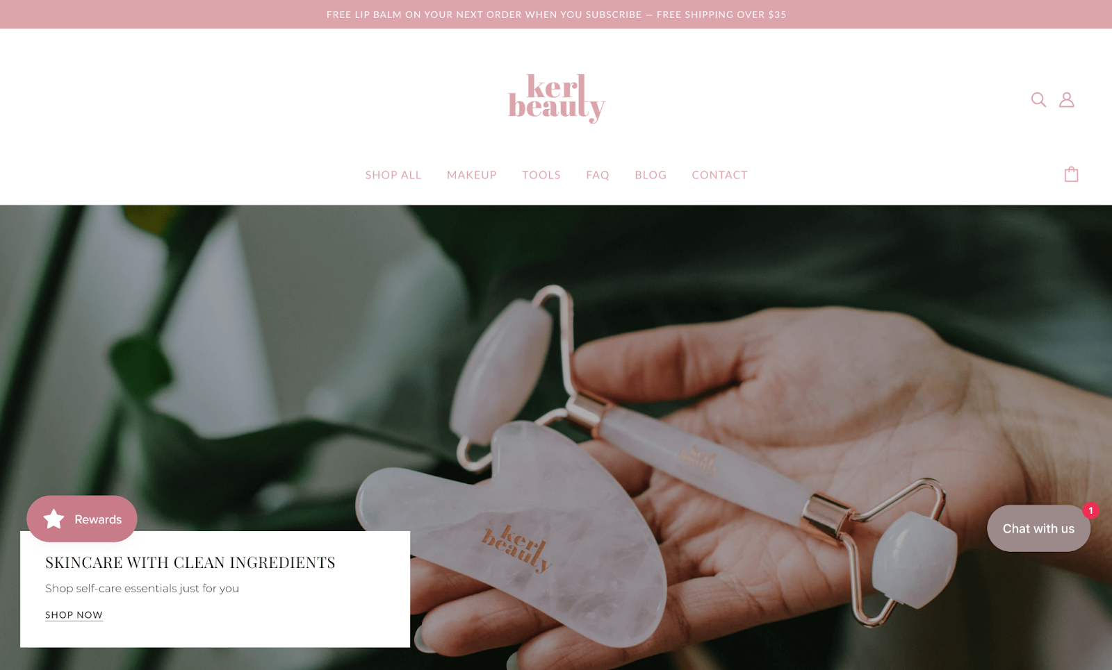 Support Black-owned businesses–A screenshot from Kerl Beauty’s homepage. There is an image of a hand holding a pink, crystal patterned jade roller and gua sha tool with the Kerl Beauty logo on them. There is a white text box that reads, “Skincare with clean ingredients. Shop self-care essentials just for you. Shop now”. 