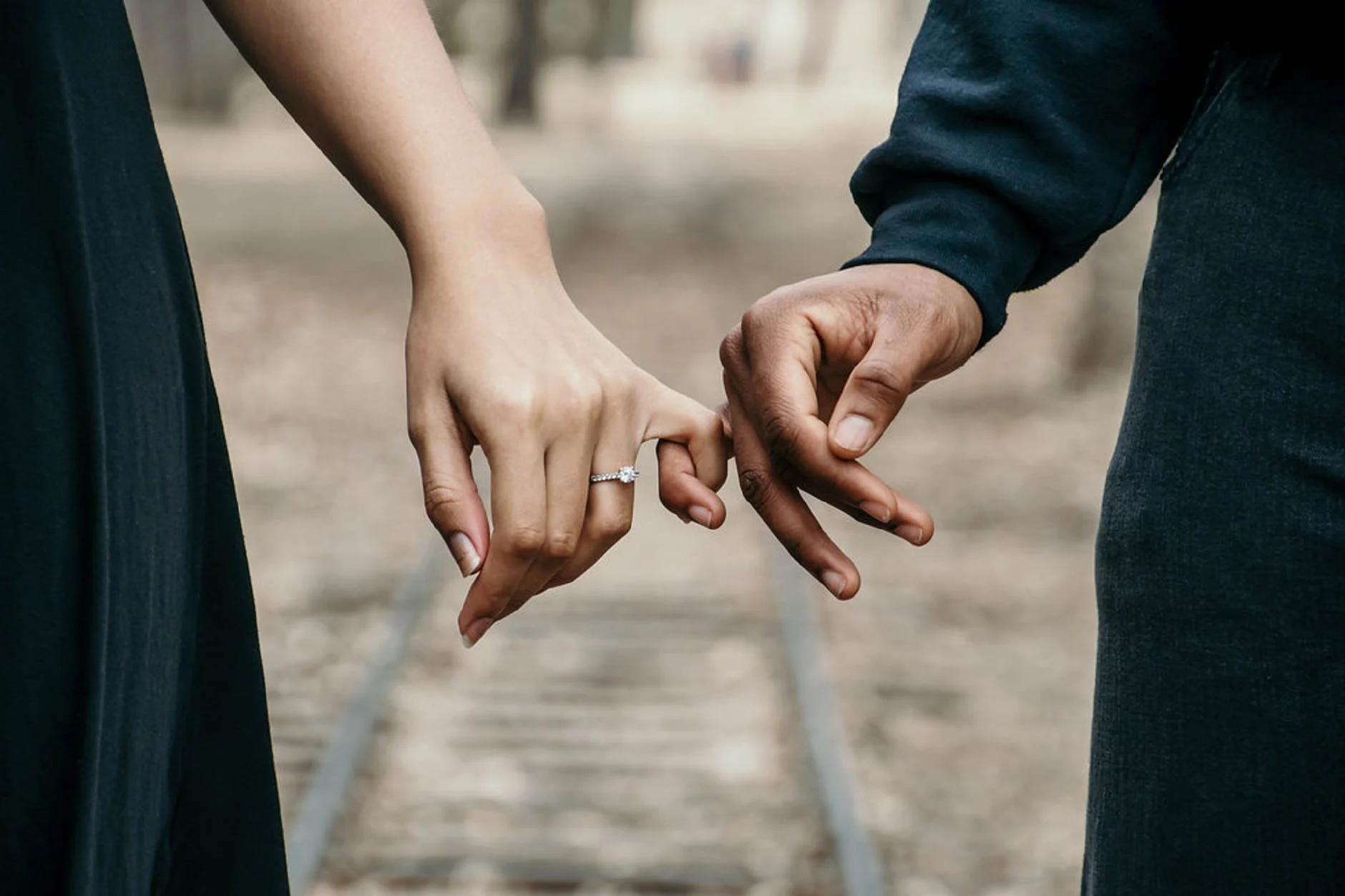 couple holding hands relationship