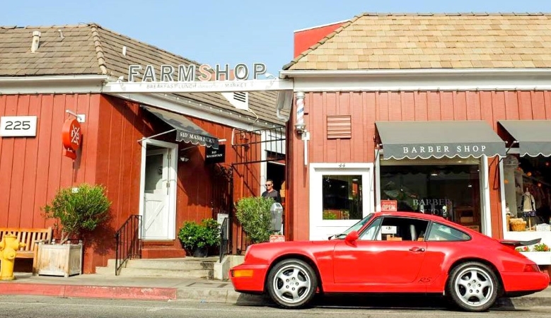 A classic sports car parked outside of Brentwood Country Mart in Los Angeles, CA