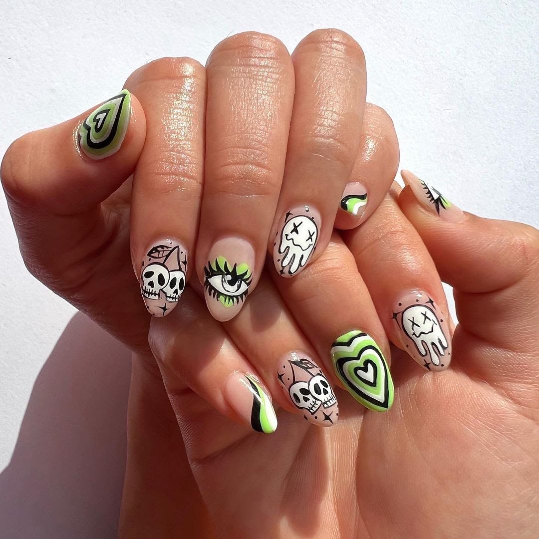 Green mix and match summer nail idea with ghosts