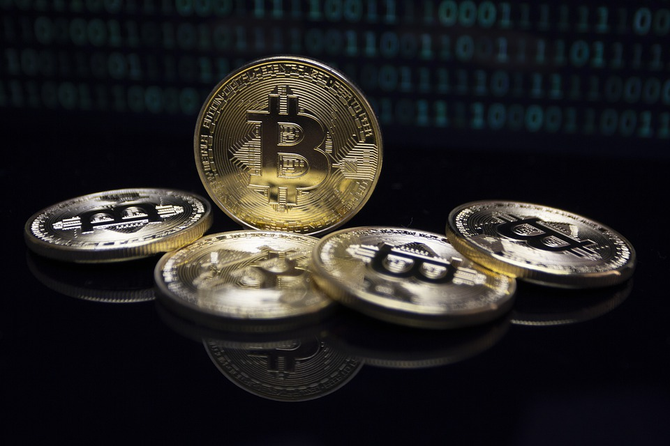 Five Bitcoin coins 