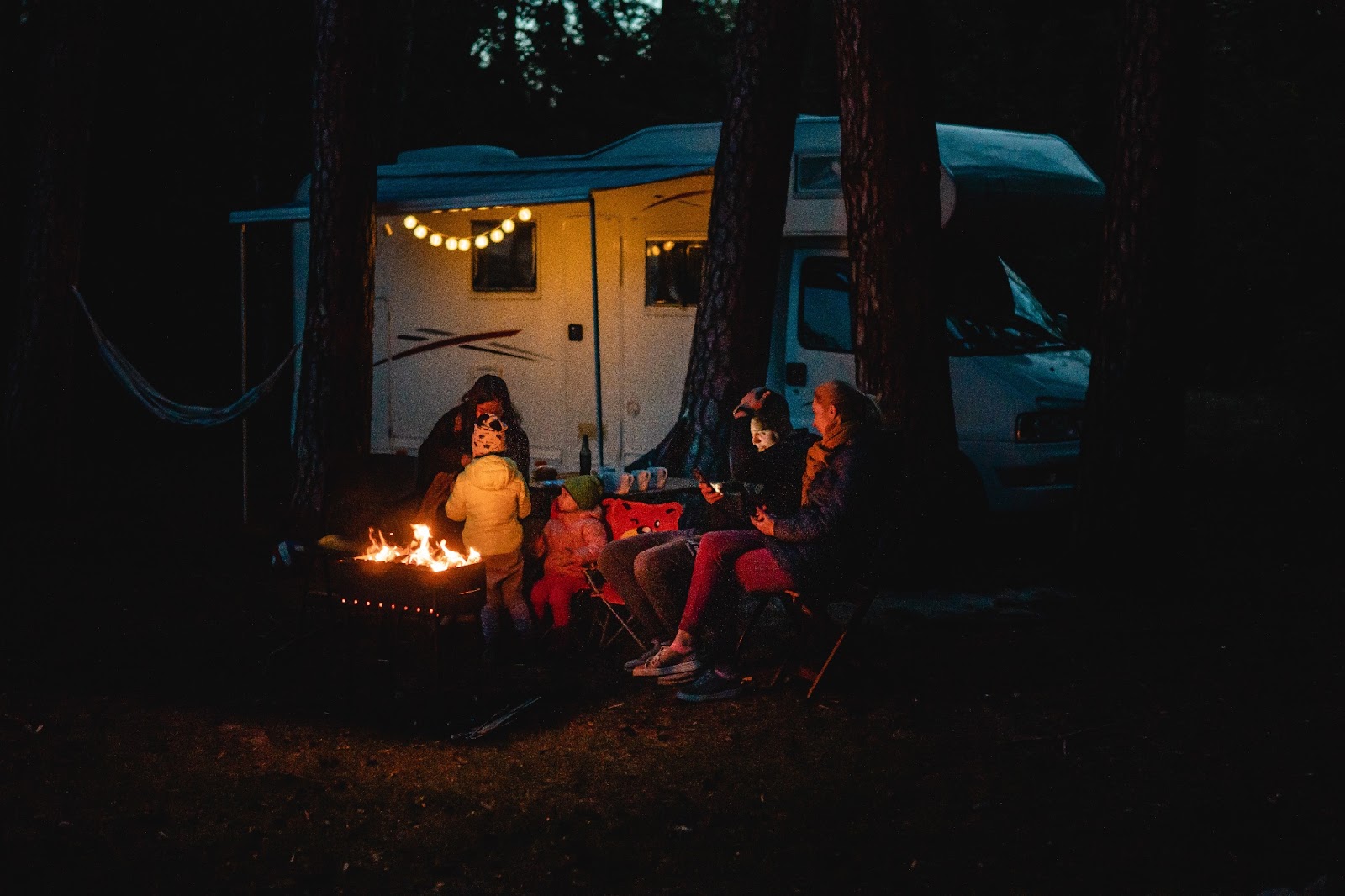 Family camping at night