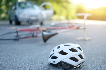 Broken bicycle on the asphalt after incident