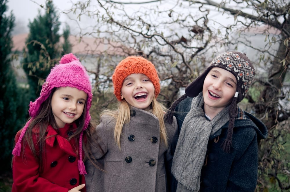 Kids in different winter outfits