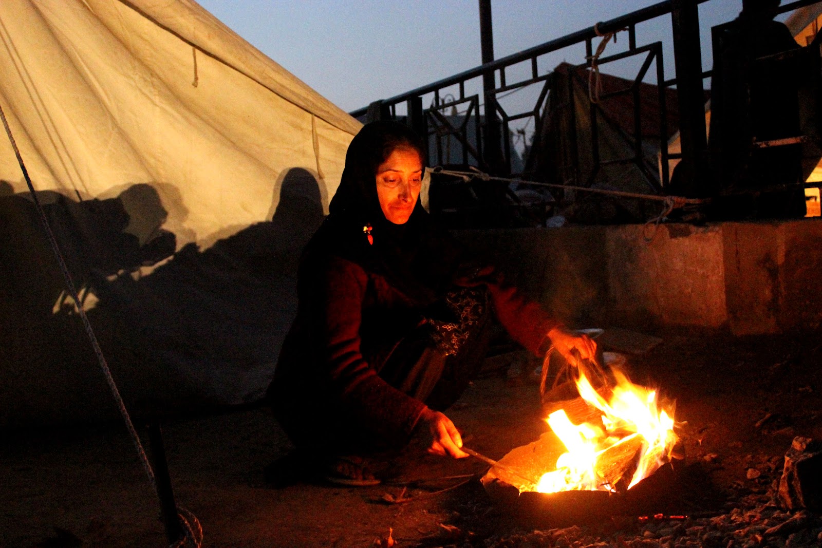 Hundreds of families were living in tents during the chili winters of Kashmir, to keep themselves warm fire port was the only source of heating..jpg