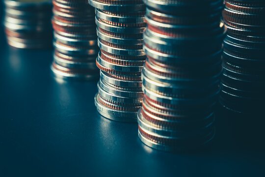 a row of coins in a row of coins - Pile of gold coins stack in finance treasury deposit bank account