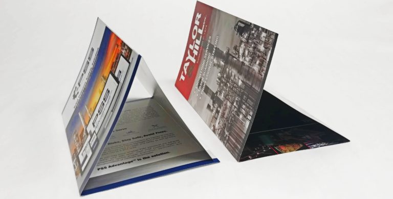 Double Gate Fold Brochure next to a Large Tri-Fold Brochure