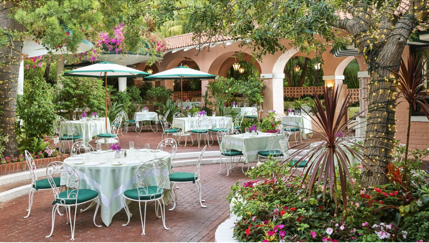 A patio with tables and chairs

Description automatically generated with medium confidence
