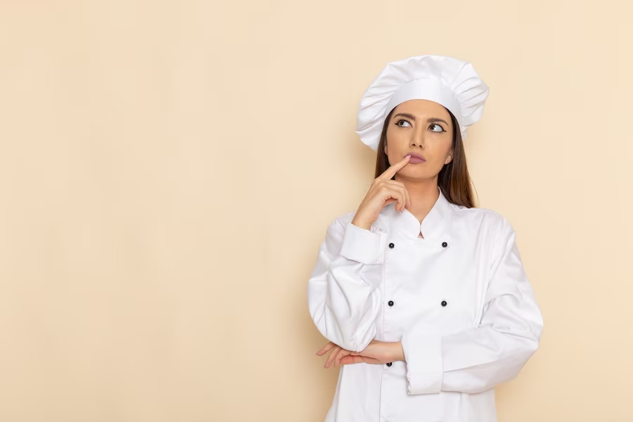 female chef wearing a white cooking suitl