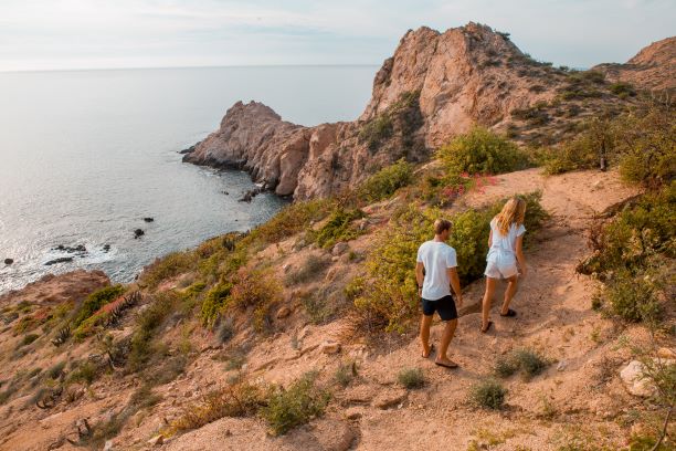 A couple exploring the beautiful mountains of Los Cabos.