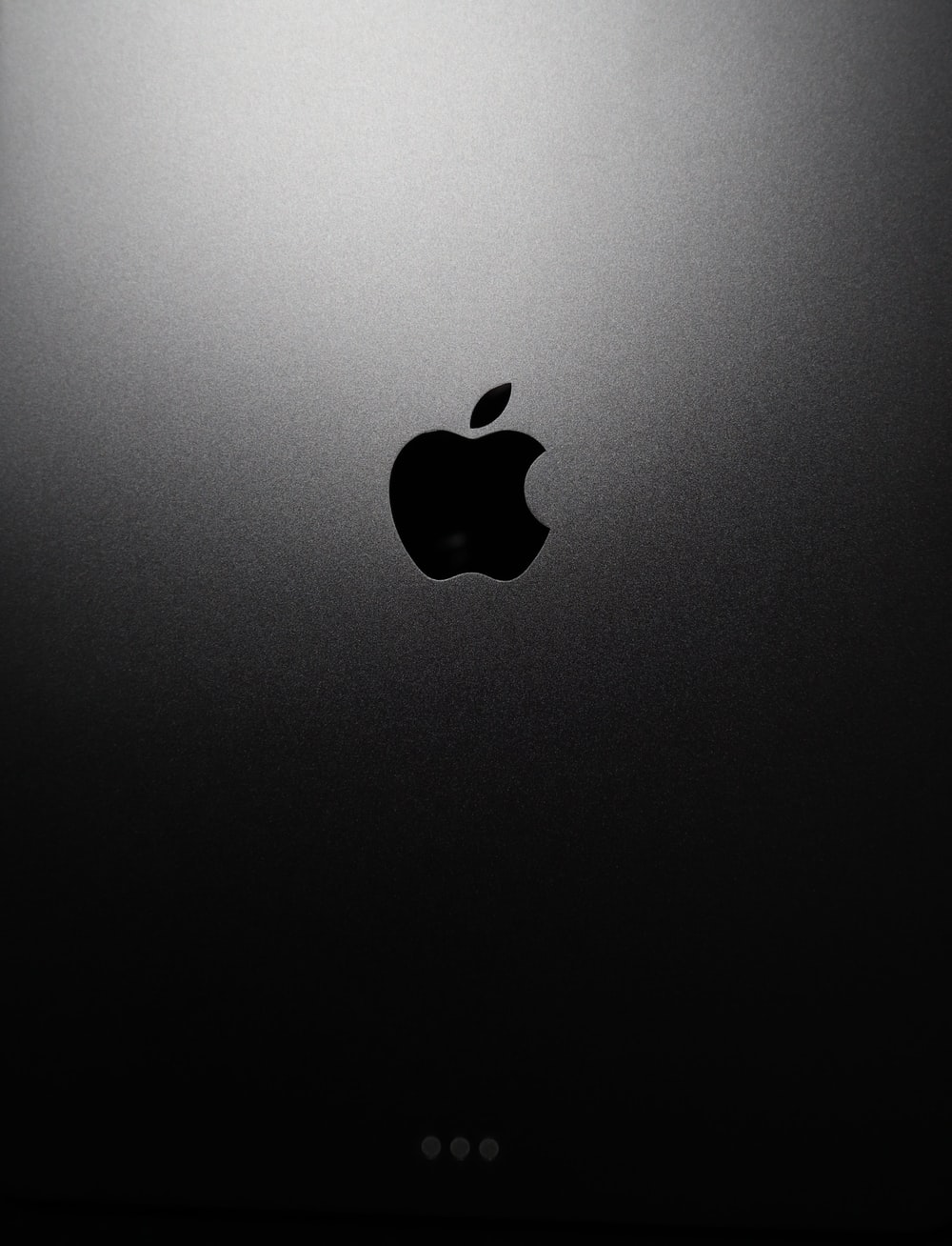 black apple logo on black surface: https://unsplash.com/photos/5TzYSqhKeyE