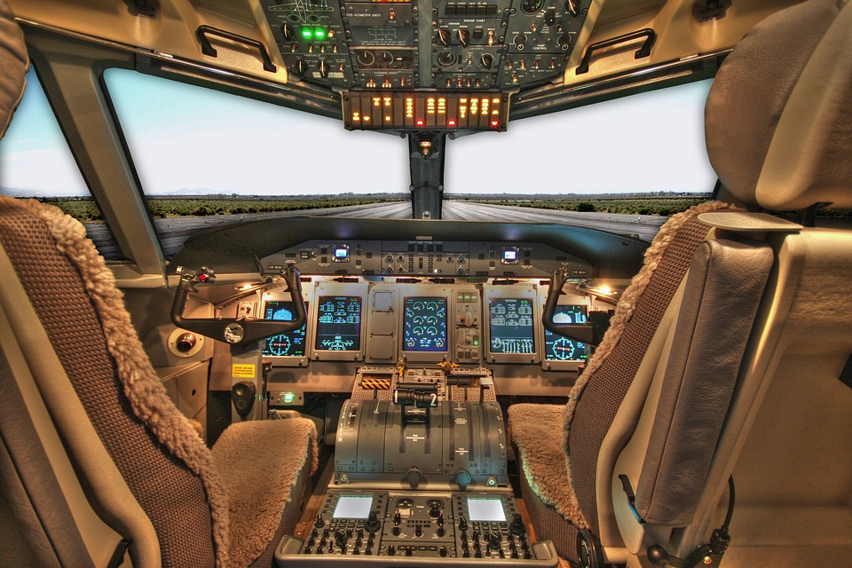 Picture of an empty cockpit of a plane on the runway.